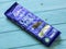 Dairy Milk Chocolate bar isolated on wooden background.