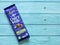 Dairy Milk Chocolate bar isolated on wooden background.