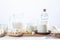 Dairy products in glass recipients and wooden dishes on  white background