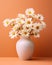 Daisies in a white minimalist vase on orange background