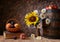 Daisy flowers in a vase with fresh fruits in a vicker basket