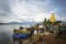 Dak Lak, Vietnam - Oct 22, 2016: Farmers are loading harvested rice from floating boat up to transport vehicle in Lak district