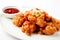 Dakgangjeong: Crispy fried chicken bites with sweet and spicy sauce, Generative AI