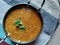 Dal fry or traditional Dal Tadka Curry served in a bowl, Indian popular food.