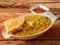 Dal khichdi or Khichadi, Tasty Indian recipe served in bowl over rustic wooden background, The food made of dal and rice combined