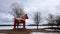 Dalarna horse in front of Saxviken part of lake Siljan in Mora, Sweden