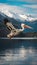 Dalmatian Pelican Flying Over Serene Lake with Snow Capped Mountains