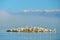 Dalmatian pelican island with fog, Pelecanus crispus, landing in Lake Kerkini, Greece. Pelican with open wings. Wildlife scene