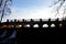 The dam of the breeding fish pond has a canal safety overflow similar to a weir. the water flows under a stone bridge with several