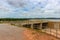 The dam crest the concrete spillway. countryside blocks the river to store water