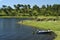 dam that forms a reservoir in a mountainous context. Dinghies sailing on the lake. Embalse de Rio Tercero,