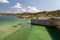 Dam of the Gadoura water reservoir on Rhodes island, Greece with  blue and turquoise water