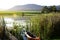 Dam with jetty and canoe in the Garden Route, South Africa