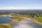 Dam lake reservoir drone aerial view of Barragem do Caia Dam olive trees landscape in Alentejo, Portugal