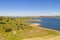 Dam lake reservoir drone aerial view of Barragem do Caia Dam olive trees landscape in Alentejo, Portugal