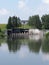 Dam reflected in waters of pond in Goczalkowice in Poland - vertical