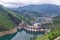 Dam wall and surrounding landscape at Wulong Dam in Chongqing, China. during summer with a low water level on a clear sunny day