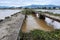 Damaged bridge across flowing river