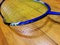 Damaged, broken badminton racket