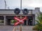 Damaged broken road sign warning that there is a railway ahead.