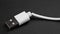 Damaged broken white cellphone charger usb cable