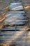 Damaged broken wooden trail in the city park