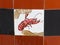 Damaged ceramic tile with image of lobster on it