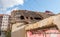 Damaged and collapsed roof tiles after aftermath earthquake or hurricane on the old ruined domestic house with broken windows sele