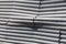 Damaged corrugated iron fence