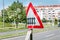 Damaged and distorted railway sign with railroad crossing road symbol signalization in the city