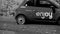 Damaged ENJOY car sharing car parked. company active since 2013 that uses the FIAT 500