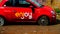 Damaged ENJOY car sharing car parked. company active since 2013 that uses the FIAT 500 all managed by smatphone app