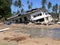 damaged house sinking in to the water in mangrove forest, collapsed old house in the water