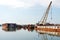 Damaged industrial boats at the bay