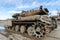 damaged military tank on a city street in Ukraine