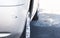 Damaged scratches white bumper after car crash