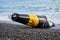 Damaged sea buoy - cardinal danger mark - washed ashore after a storm