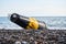 Damaged sea buoy cardinal danger mark washed ashore after a storm