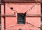 Damaged shrine in Pashupatinath  diagonal shear cracks running from window\\\'s corners in unreinforced brick masonry