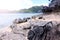 Damaged sunglasses on the rocks on the beach.