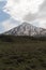 Damavand peak in the shadow of white clouds