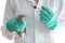 Dambo rat on the hands of a veterinarian on a white isolated background