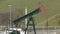 DAMBORICE, CZECH REPUBLIC, NOVEMBER 15, 2021: Oil pump jack fracking crude pumpjack extraction machine field, fossil