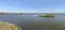 dams, braodwalk and fishing huts on the brackish lagoon, Comacchio, Italy