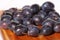 Damsons on wooden chopping board B