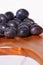 Damsons on wooden chopping board C