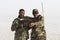 Danakil, Ethiopia, January 22 2015: Two soldiers posing proudly with their guns in the Danakil desert