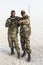 Danakil, Ethiopia, January 22 2015: Two soldiers posing proudly with their guns in the Danakil desert