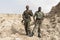 Danakil, Ethiopia, January 22 2015: Two soldiers posing proudly with their guns in the salt mountains of the Danakil desert