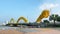 DANANG, VIETNAM - January 10, 2023: Car traffic on Dragon Bridge, a key road over the Han River, Da Nang, Vietnam.